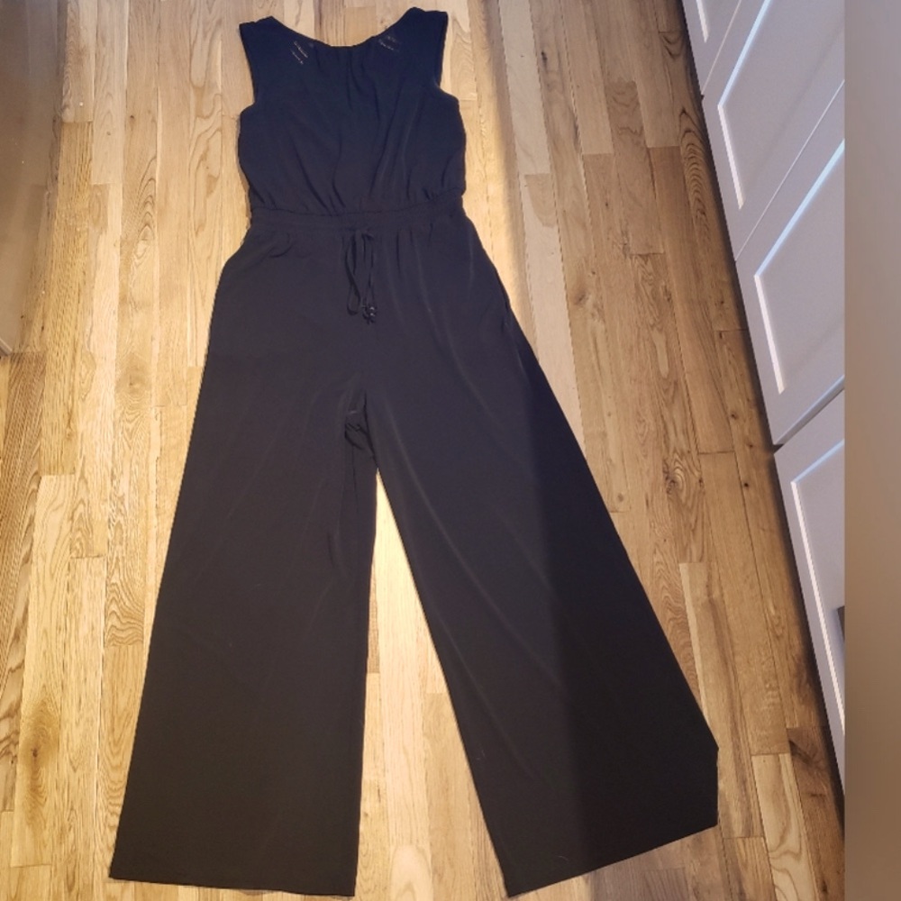 Vince Camuto black jumpsuit with crochet details on front and small vneck back